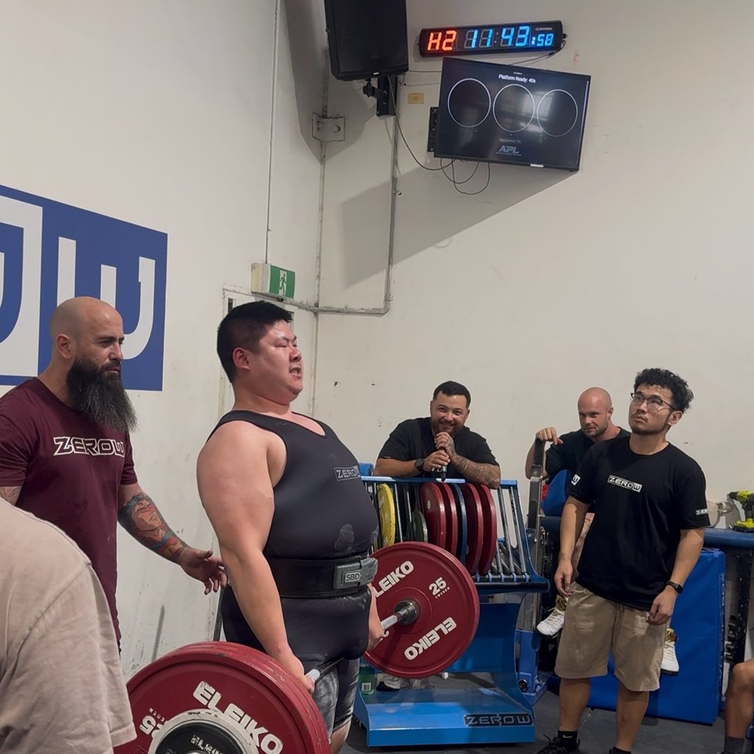 Coach Jacky's athlete locking out a deadlift at a powerlifting meet